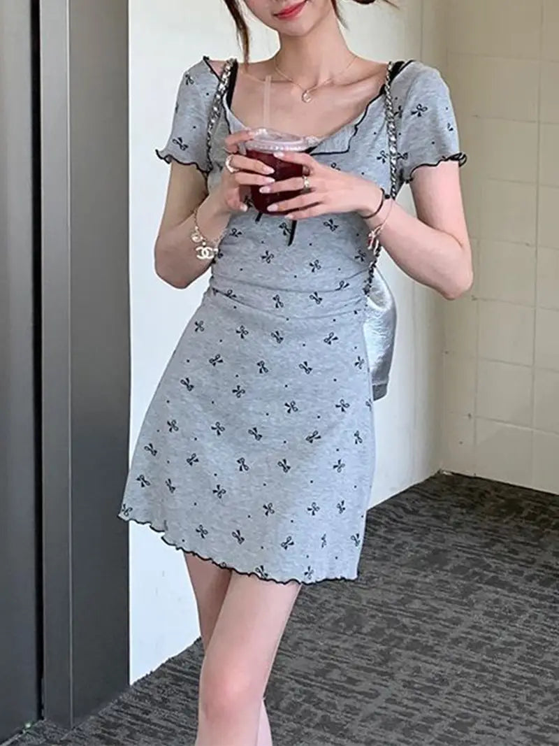 Fit, Casual Chic | Light Blue Floral Print Mini Dress with Decorative Bow & High Neckline | Women'S Fashion | No Belt, Short Sleeve | Adult Size | Perfect for Casual Attire, Summer Casual Wear | Chic Mini Dress | Stylish Ruffle Detail